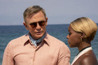 This image released by Netflix shows Daniel Craig, left, and Janelle Monáe in a scene from "Glass Onion: A Knives Out Mystery." (John Wilson/Netflix via AP)