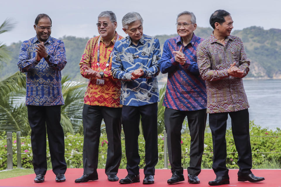 From left, Malaysia's Foreign Minister Zambry Abd Kadir, Philippines' Secretary of Foreign Affairs Enrique Manalo, Singapore's head of senior official delegate Albert Chua, Thailand's Foreign Minister Don Pramudwinai and Vietnam's Foreign Minister Bui Thanh Son applaude after a photo session during the Association of Southeast Asian Nations (ASEAN) Foreign Ministers' Meeting ahead of the 42nd ASEAN Summit in Labuan Bajo, East Nusa Tenggara, Indonesia, Tuesday, May 9, 2023. (Mast Irham/Pool Photo via AP)