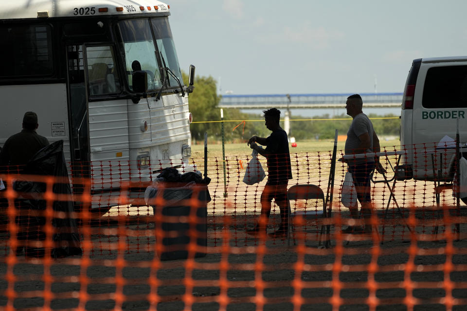 Migrants who crossed the Rio Grande to the U.S. from Mexico are processed by U.S. Border Patrol agents, Friday, Sept. 22, 2023, in Eagle Pass, Texas. (AP Photo/Eric Gay)