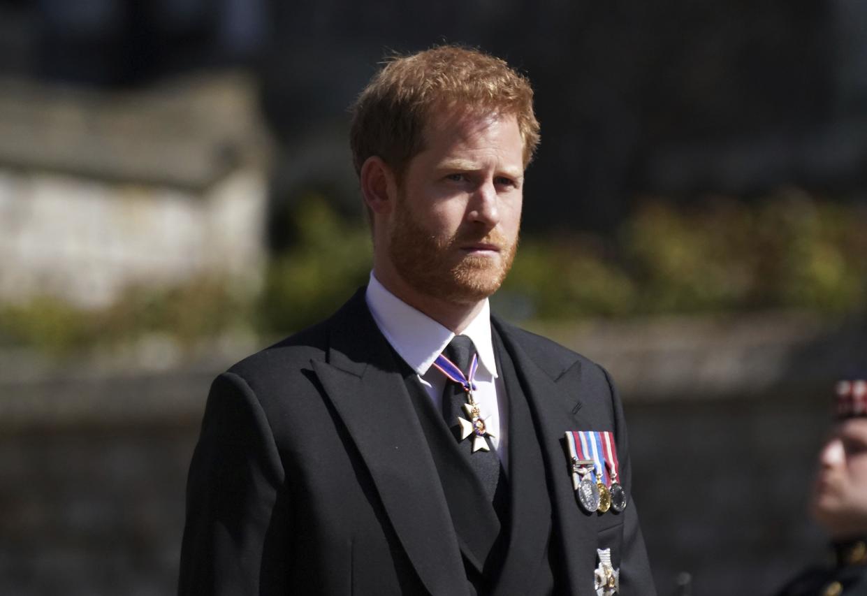 Prince Harry walks in the procession, ahead of Britain Prince Philip's funeral at Windsor Castle, Windsor, England, Saturday April 17, 2021.