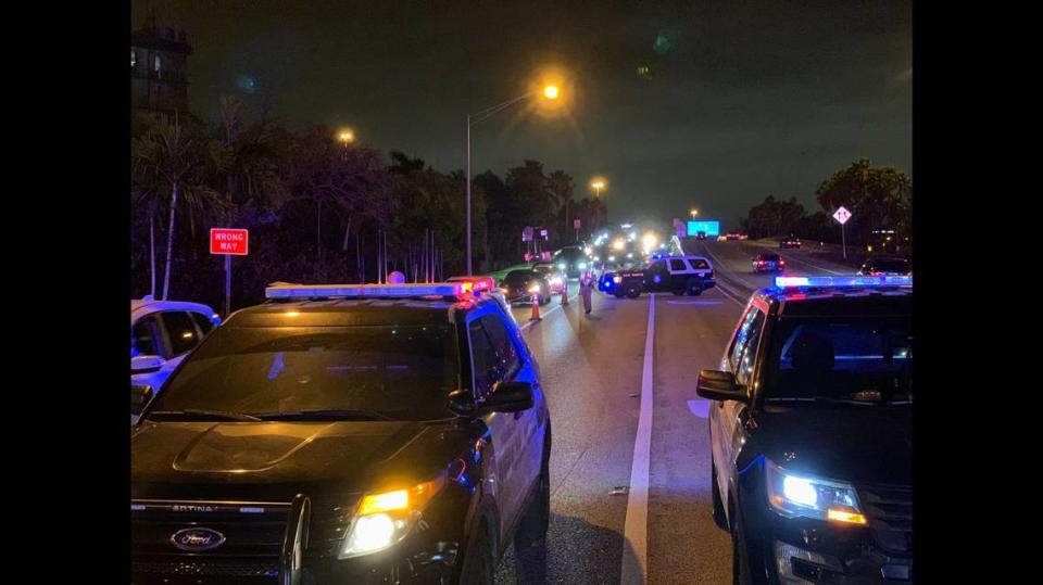 Miami Beach police screen drivers entering the city via the Julia Tuttle Causeway after 9 p.m. Saturday. Only Miami Beach residents, hotel guests and business employees were allowed in from 9 p.m. to 6 a.m. Sunday.