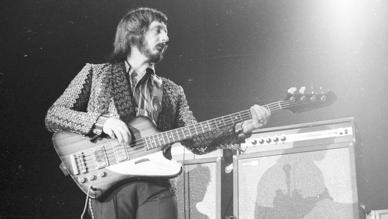  Bassist John Entwistle of the rock and roll band "The Who" performs onstage in February 1975. 