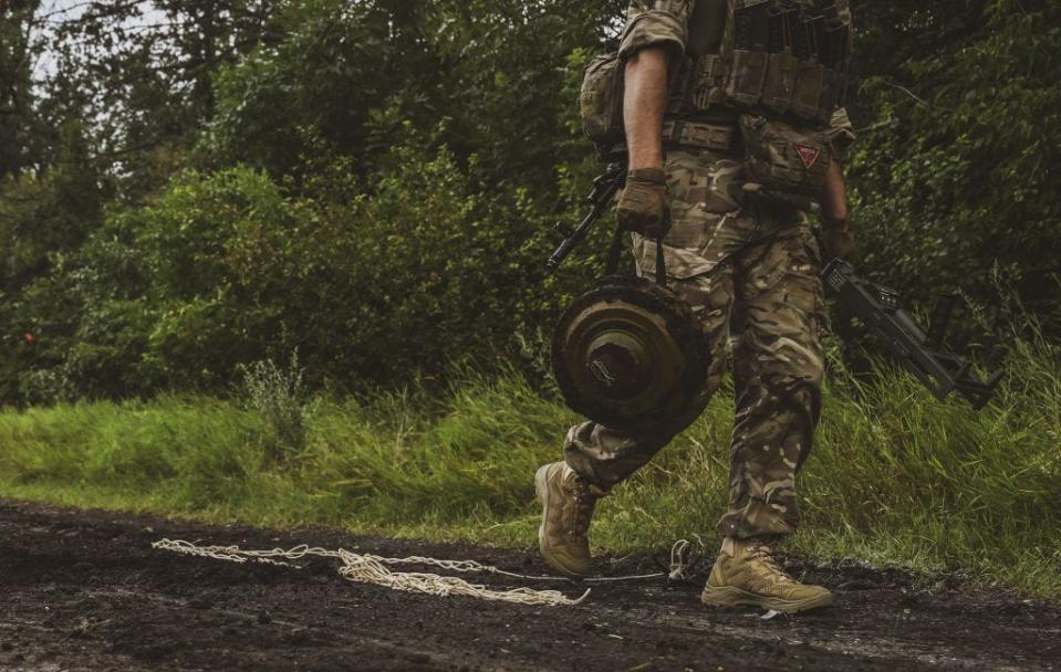 Ukrainian army's 35th Marine Brigade members conduct mine clearance work at a field in Donetsk, Ukraine on July 11, 2023.