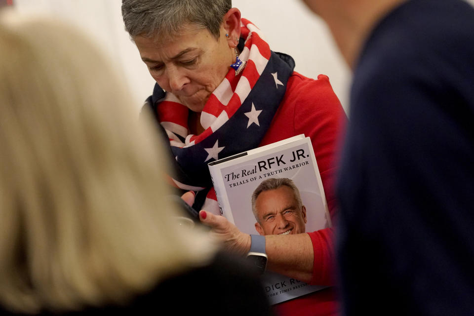 A voter waits in line to meet Independent presidential candidate Robert F. Kennedy Jr. prior to a voter rally, Wednesday, Dec. 20, 2023, in Phoenix. (AP Photo/Matt York)