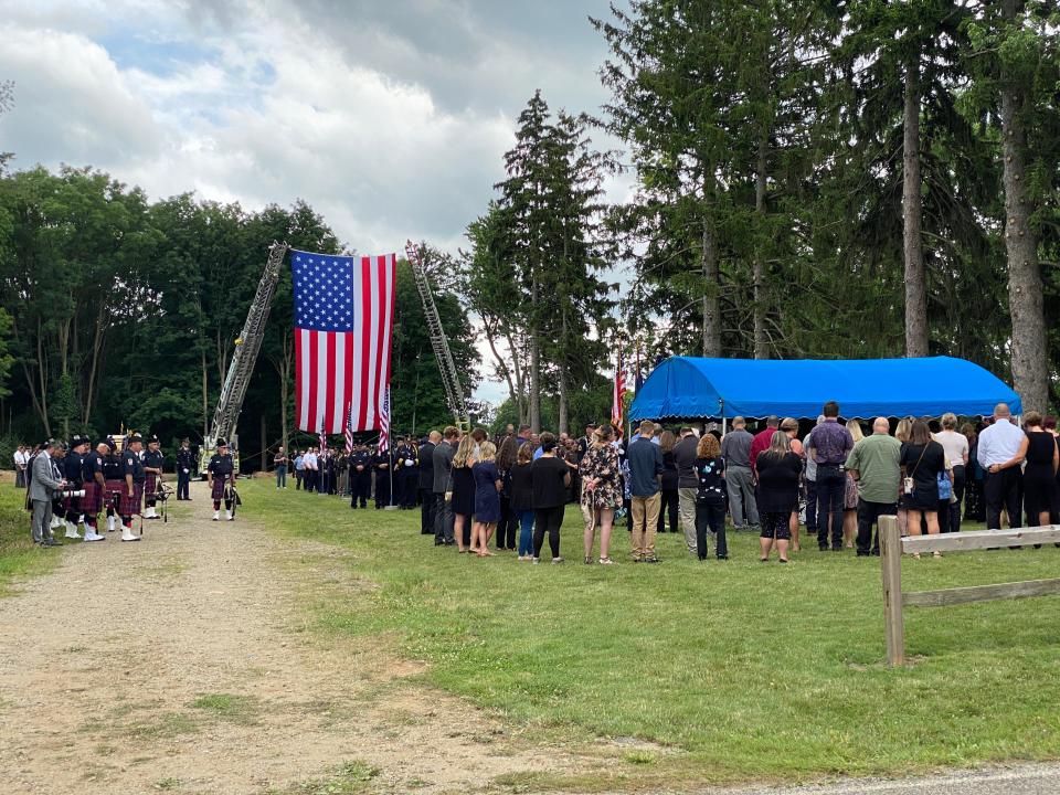 A graveside ceremony for Hillsdale County Sheriff's Deputy William Butler Jr. is conducted Wednesday at Lakeview Cemetery in Hillsdale.