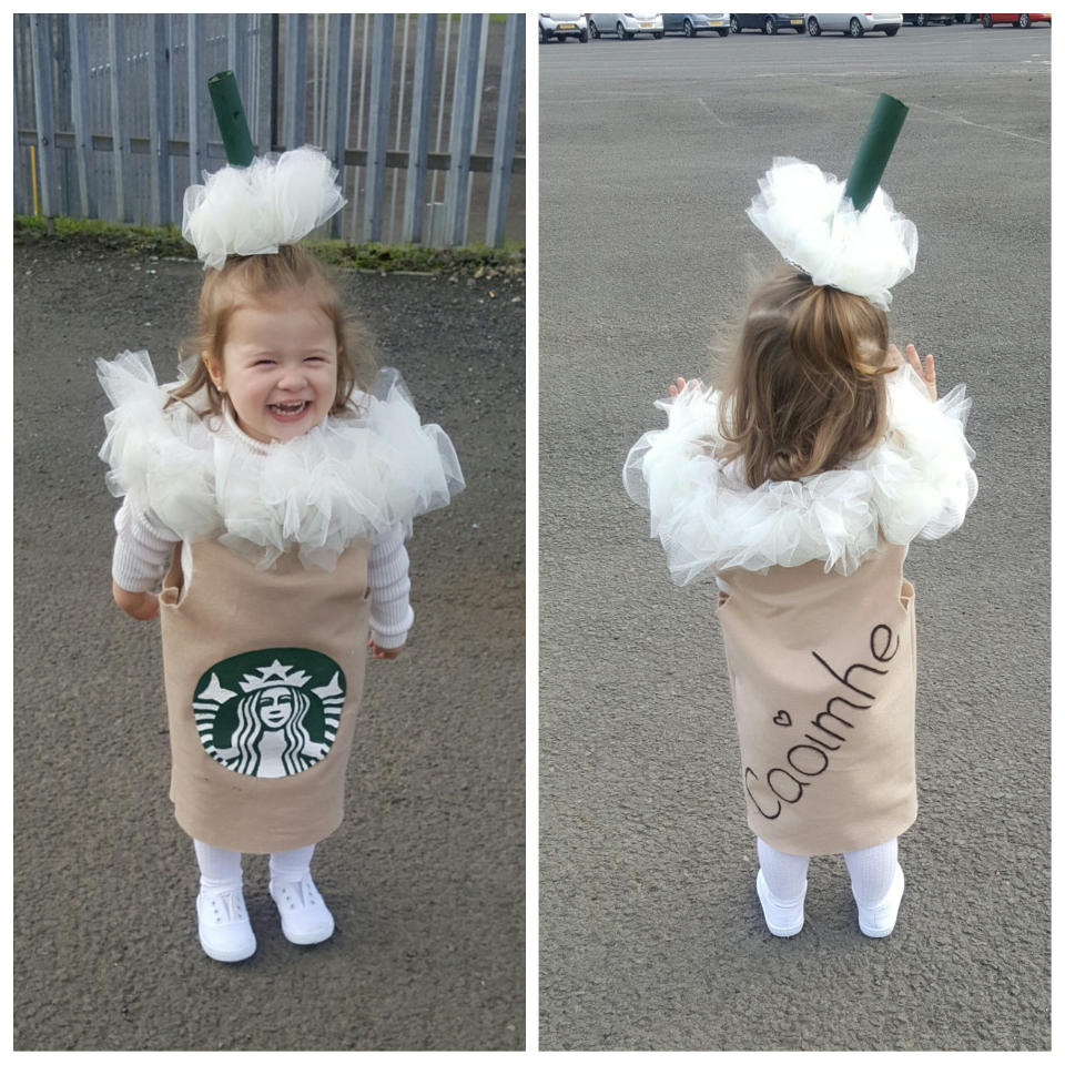 Little Caoimhe has also dressed up as a Starbucks cup [Photo: SWNS]