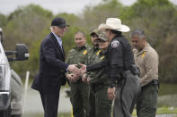 FILE - President Joe Biden talks with the U.S. Border Patrol and local officials, as he looks over the southern border, Feb. 29, 2024, in Brownsville, Texas, along the Rio Grande. (AP Photo/Evan Vucci, File)