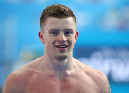 Swimming – 17th FINA World Aquatics Championships – Men's 50m Breaststroke Preliminary – Budapest, Hungary – July 25, 2017 – Adam Peaty of Britain reacts. REUTERS/Michael Dalder
