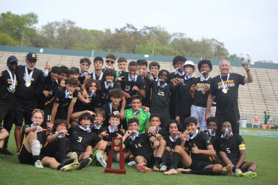 American Heritage’s boys’ soccer team celebrates its eighth state championship all-time and first since 2019 after beating Naples 3-1 in the Class 5A final on Saturday at Spec Martin Stadium in DeLand, Fla.