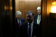 FILE PHOTO: U.S. Senate Majority Leader Mitch McConnell (R-KY) and Senator Richard Shelby (R-AL) board an elevator to depart the Capitol to go to the White House to meet with U.S. President Donald Trump, as members of the legislative branch are faced deadlines for a federal government shutdown, in Washington, U.S. December 21, 2018. REUTERS/Jonathan Ernst/File Photo