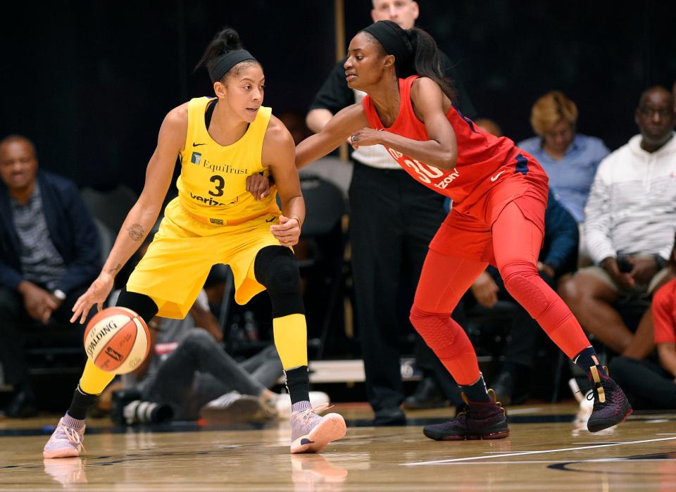 Mystics forward LaToya Pringle Sanders, a two-time state champ at Seventy-First, guards Sparks forward Candace Parker during a WNBA playoff game in 2018. Sanders and Parkers faced off many times in the WNBA and in college, when Sanders played for UNC and Parker for Tennessee.