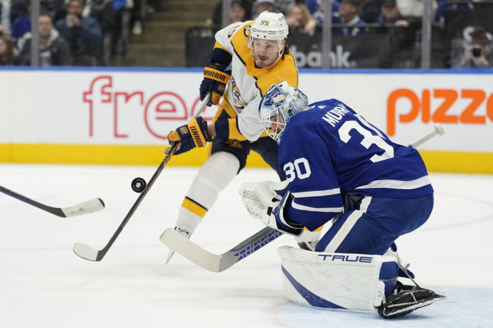 Nashville Predators center Matt Duchene (95) tries to defect the puck pass Toronto Maple Leafs goaltender Matt Murray (30) during the first period of an NHL hockey game, Wednesday, Jan. 11, 2023 in Toronto. (Frank Gunn/The Canadian Press via AP)