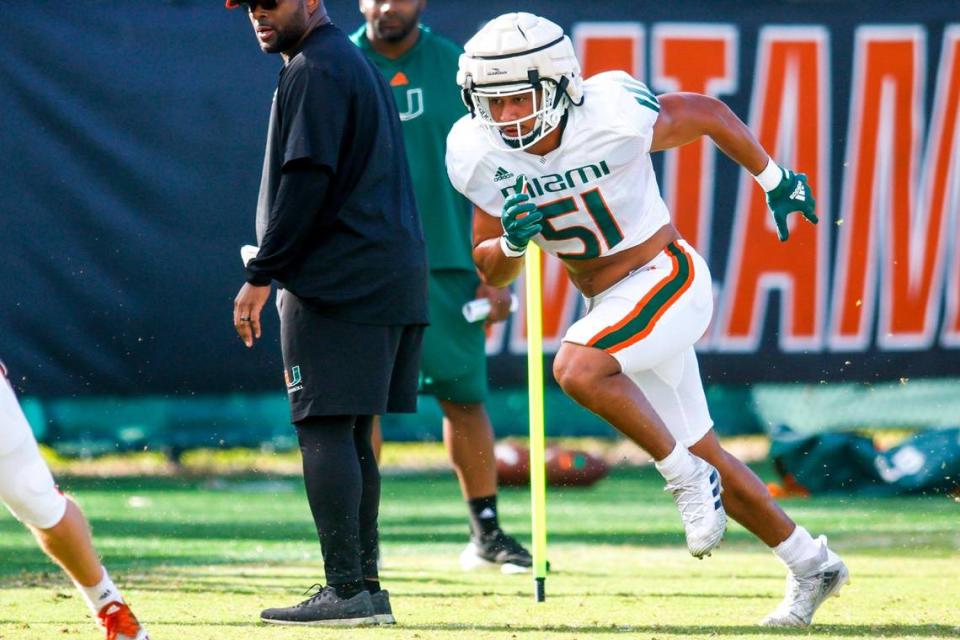 Miami Hurricanes linebacker Francisco Mauigoa (51) works out during football practice at the University of Miami campus in Coral Gables, Florida, Thursday, March 23, 2023.