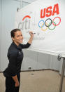 NEW YORK, NY - JULY 27: Olympic silver medalist Alicia Sacramone signs the Citi Team USA Flag inside the financial center at Citi's Headquarters on July 27, 2011 in New York City. (Photo by Mike Coppola/Getty Images for Citi)