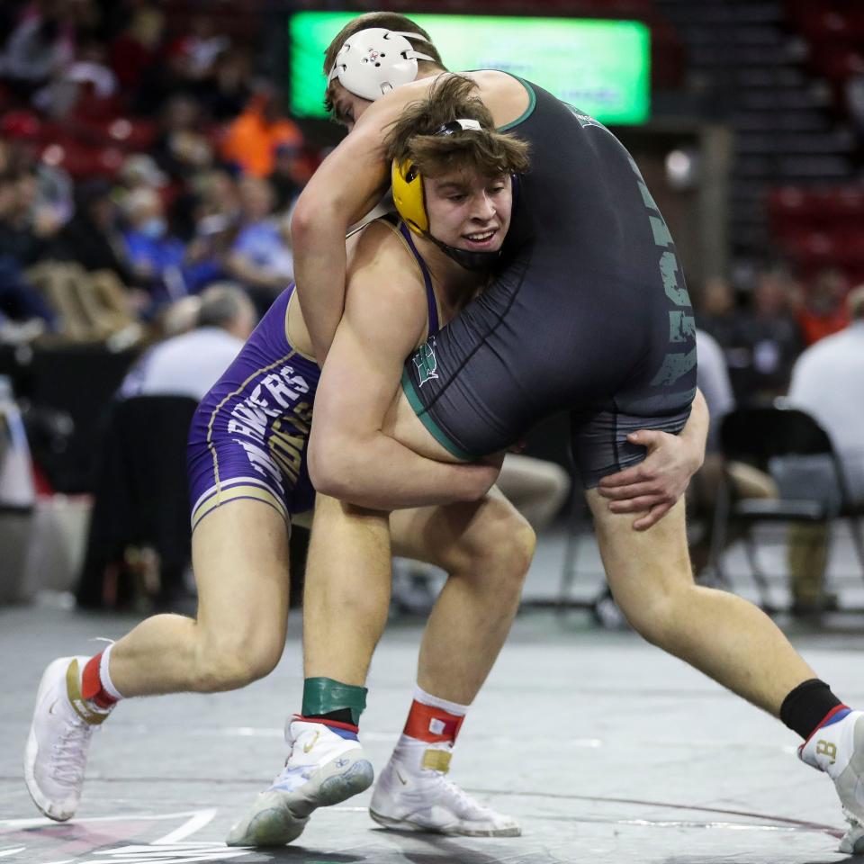 Two Rivers High School's Chase Matthias takes a shot against Kewaskum High School's Dylan Soyk in a 195-pound Division 2 preliminary match during the WIAA State Individual Wrestling Tournament on Thursday, February 24, 2022, at the Kohl Center in Madison, Wis. Tork Mason/USA TODAY NETWORK-Wisconsin