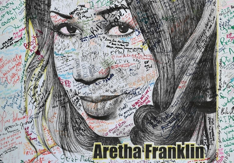 An Aretha Franklin poster signed by fans hangs outside the Charles H. Wright Museum of African American History in Detroit