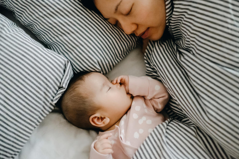 A mum has warned about the risks of co-sleeping after her long hair nearly choked her son [Photo posed by models: Getty]