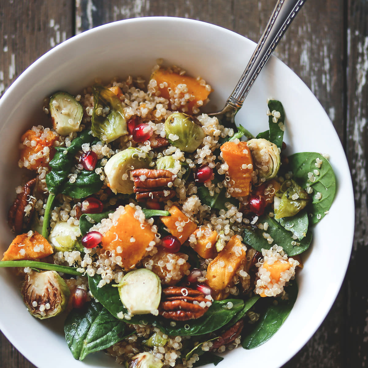 winter vegetable salad bowl of quinoa, sweet potato, spinach, and more