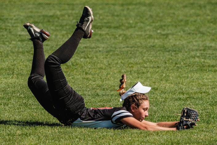 Strasburg's right field Rylee Becker makes a diving catch in the first inning to keep the game scoreless during their Division 4 State Softball Championship game against Lincolnview Saturday, June 4 at Firestone Stadium in Akron.