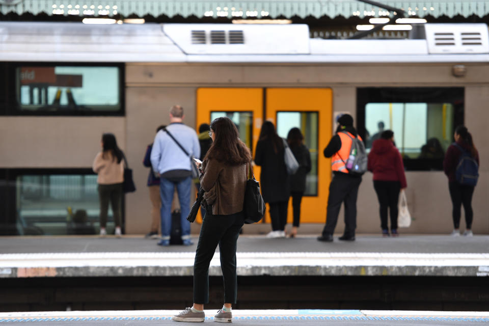 Sydney commuters and school students return to public transport at Strathfield Train Station.