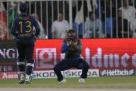 Sri Lanka's Asitha Fernando, center, takes the catch of Afghanistan's Ibrahim Zadran during the T20 cricket match of Asia Cup between Sri Lanka and Afghanistan, in Sharjah, United Arab Emirates, Saturday, Sept. 3, 2022. (AP Photo/Anjum Naveed)