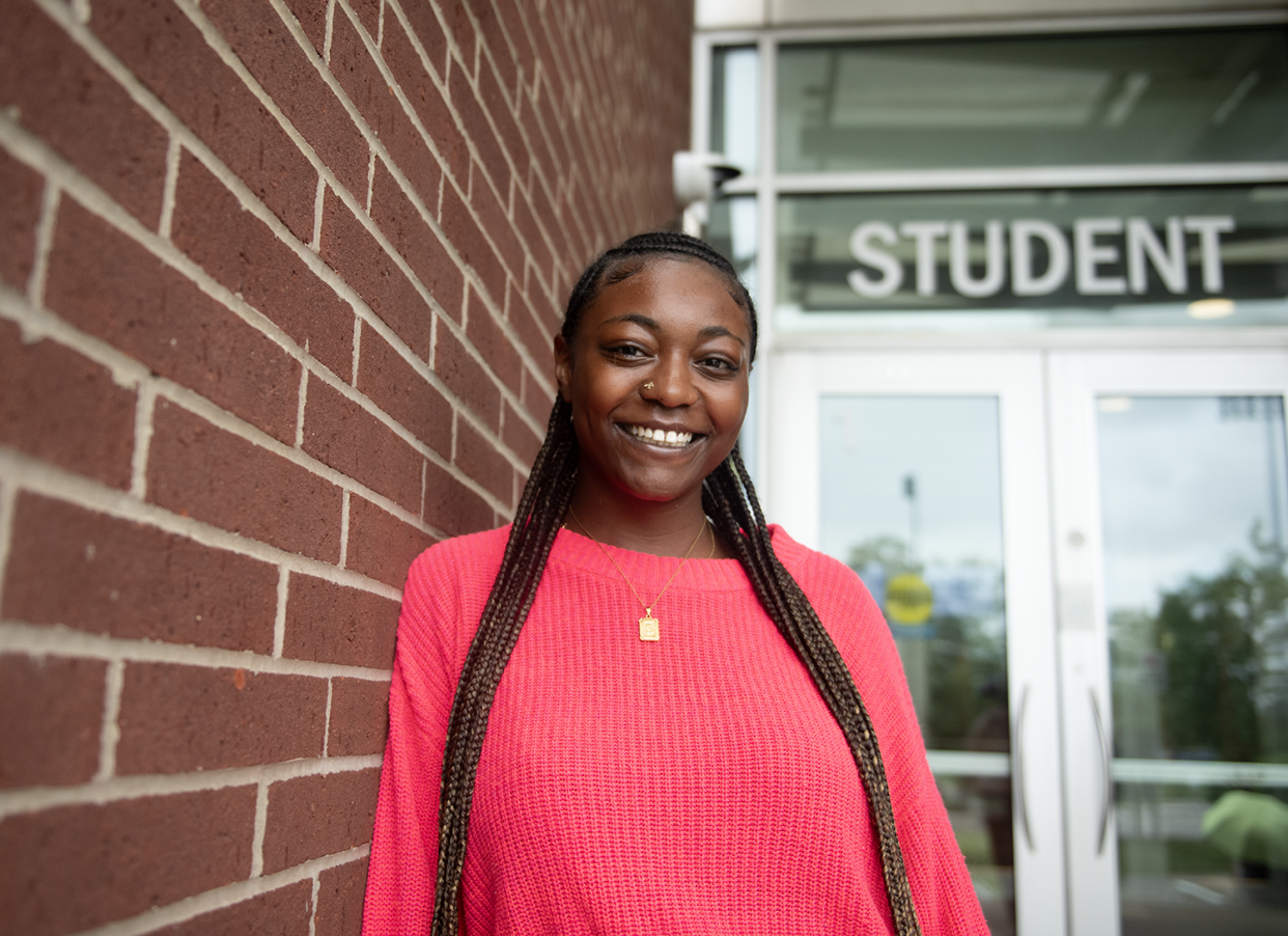 Sydney Montique stands outside University of Akron's Student Union July 30. Montique is voting for the first time in the upcoming presidential election.