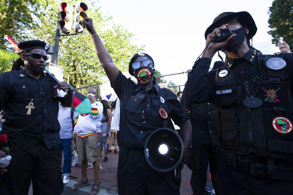 Demonstrators wearing logos of the New Black Panther Party speak during a protest at Lafayette Square near the White House, against police brutality and racism, on June 7, 2020 in Washington, DC. (Jose Luis Magana/AFP via Getty Images)