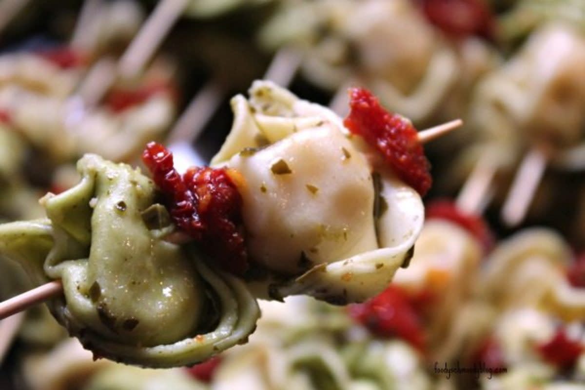 <p>Foody Schmoody Blog</p><p>Tortellini is tossed in pesto and skewered with sun-dried tomatoes for an easy and delicious appetizer.</p><p><strong>Get the recipe: <a href="https://foodyschmoodyblog.com/easy-pesto-tortellini-skewers/" rel="nofollow noopener" target="_blank" data-ylk="slk:Easy Pesto Tortellini Skewers;elm:context_link;itc:0;sec:content-canvas" class="link rapid-noclick-resp">Easy Pesto Tortellini Skewers</a></strong></p>