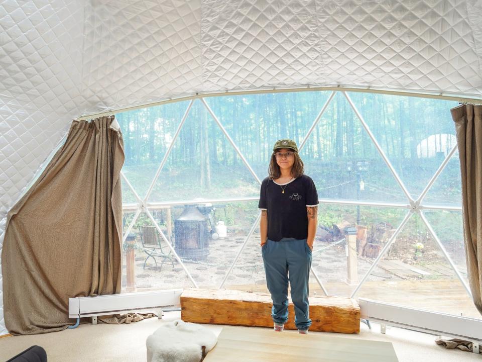 The author stands in front of the window in the dome