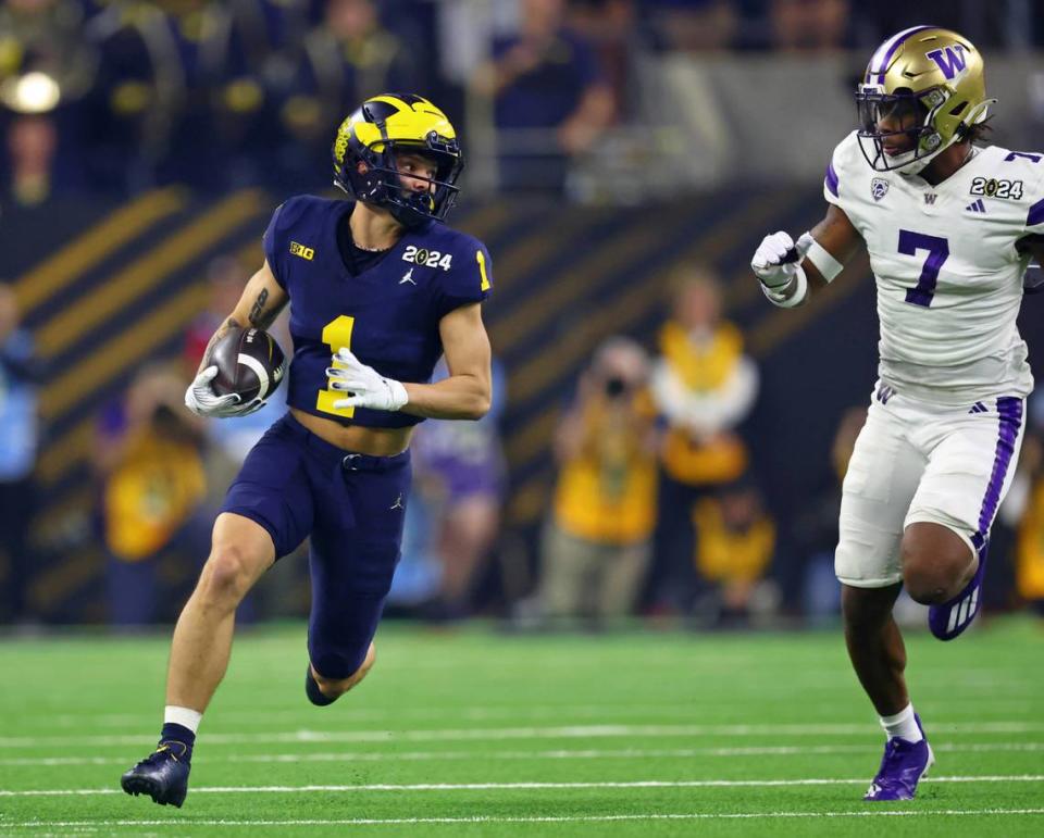 Jan 8, 2024; Houston, TX, USA; Michigan Wolverines wide receiver Roman Wilson (1) runs with the ball against the Washington Huskies during the first quarter in the 2024 College Football Playoff national championship game at NRG Stadium. Mandatory Credit: Mark J. Rebilas-USA TODAY Sports Mark J. Rebilas/Mark J. Rebilas-USA TODAY Sports