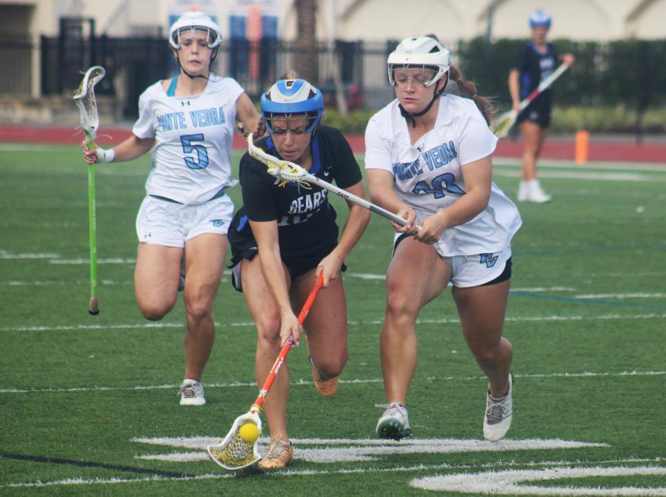 Bartram Trail attacker Ryann Frechette (10) challenges for a ground ball as Ponte Vedra's Lily Mosser (5) and Lily Toole (18) pursue during the Rivalry on the River tournament. All three received awards from the First Coast Girls Lacrosse Coaches Association.