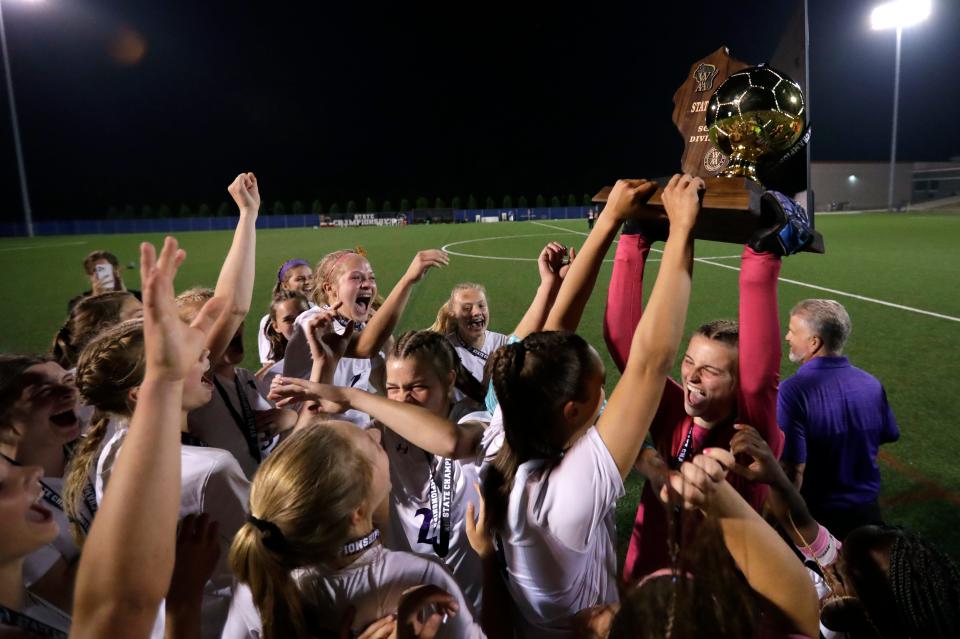 Kiel High School's goalie Katelyn Uselding (99) raises the trophy and celebrates with teammates after defeating Cedar Grove-Belgium High School during their WIAA Division 4 girls soccer championship game Saturday, June 17, 2023, at Uihlein Soccer Park in Milwaukee, Wis. Dan Powers/USA TODAY NETWORK-Wisconsin. 