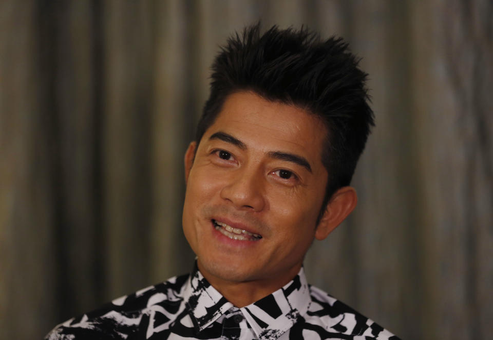 In this Friday, Jan. 10, 2014 photo, Hong Kong veteran actor and performer Aaron Kwok speaks during an interview in Hong Kong. Kwok says he brought out a softer side of a classic villain, the Bull Demon King. Kwok plays the character in the new 3-D fantasy film, "The Monkey King." He joins a stellar ensemble cast that includes other A-listers like Donnie Yen, Chow Yun Fat, and Kelly Chan. (AP Photo/Kin Cheung)