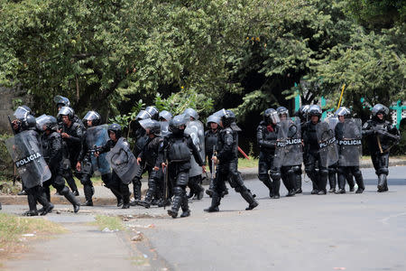 Riot police prepare to clash with demonstrators during a protest against Nicaraguan President Daniel Ortega's government in Managua, Nicaragua September 23, 2018. REUTERS/Oswaldo Rivas