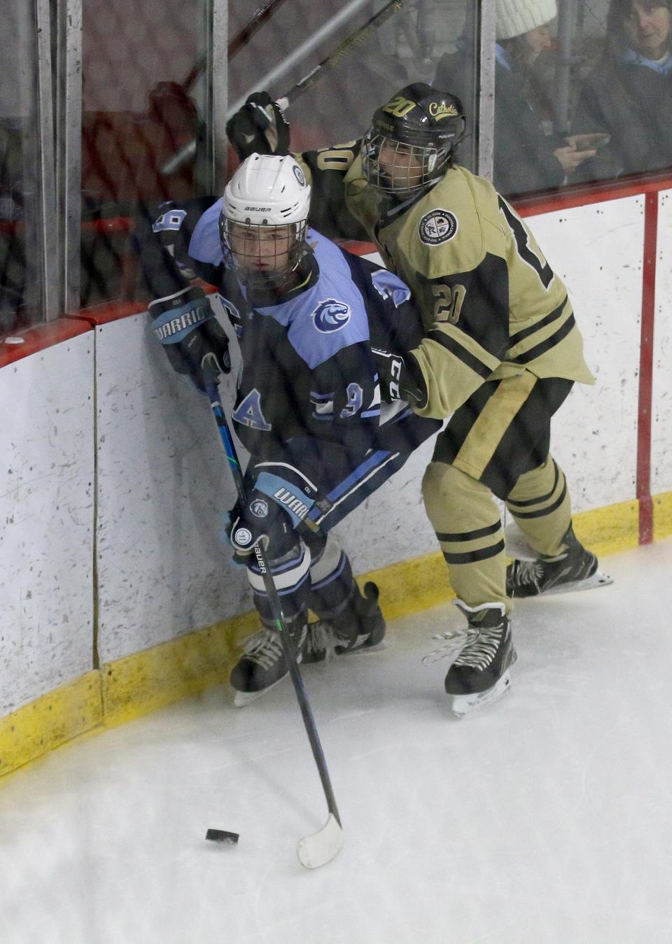 CBA's Derek Fiore (#9) moves the puck in the corner ahead of a Catholic defender during their game at the Jersey Shore Arena in Wall Monday afternoon, December 19, 2022.