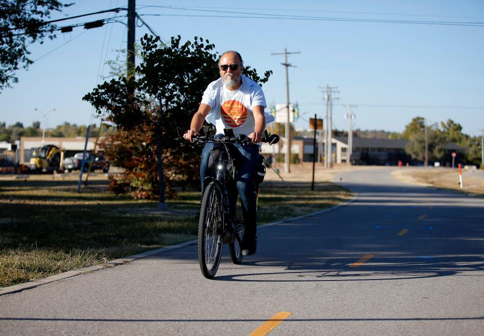 Shawn Wright commutes to work daily on his e-bike. His travels often take him past the Will Rogers Gardens.