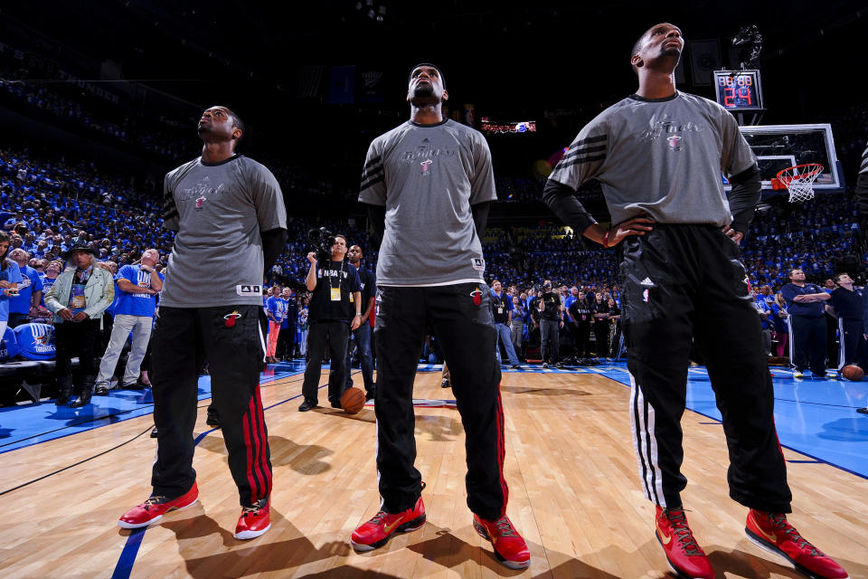 OKLAHOMA CITY, OK - JUNE 12: Miami Heat players Dwyane Wade #3, LeBron James #6 and Chris Bosh #1 listen to the National Anthem before facing the Oklahoma City Thunder in Game One of the 2012 NBA Finals at Chesapeake Energy Arena on June 12, 2012 in Oklahoma City, Oklahoma.