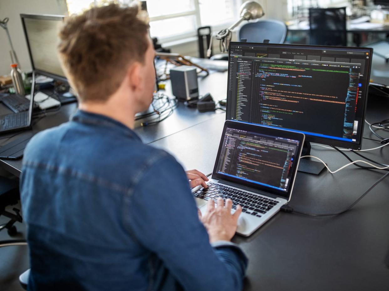 Man writing computer code