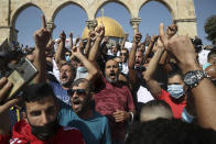 Palestinians chant slogans against French President Emmanuel Macron and the publication of caricatures of the Muslim Prophet Muhammad at the Dome of the Rock Mosque after Friday prayers in the Old City of Jerusalem, on Oct. 30, 2020. (AP Photo/Mahmoud Illean)