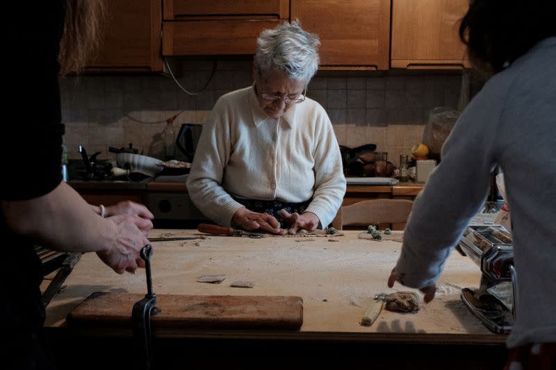 The Wider Image: In Italy, four generations in a coronavirus lockdown