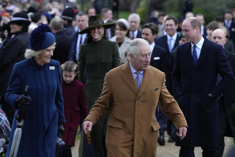 King Charles III, centre, and Camilla, the Queen Consort lead the Royal Family as they arrive to attend the Christmas day service at St Mary Magdalene Church in Sandringham in Norfolk, England, Sunday, Dec. 25, 2022. (AP Photo/Kirsty Wigglesworth)