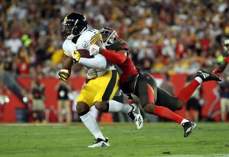 Sep 24, 2018; Tampa, FL, USA; Pittsburgh Steelers wide receiver JuJu Smith-Schuster (19) runs with the ball as Tampa Bay Buccaneers cornerback M.J. Stewart (36) tackles during the first half at Raymond James Stadium. Mandatory Credit: Kim Klement-USA TODAY Sports