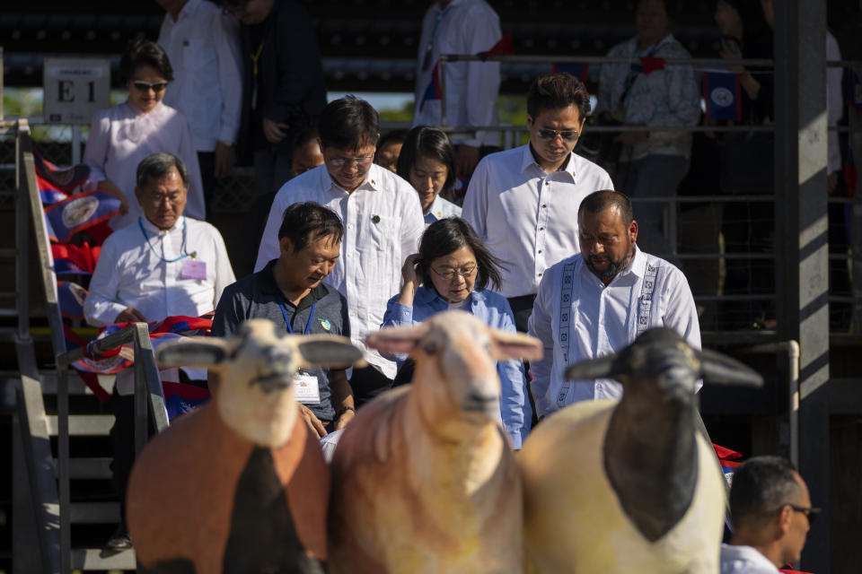Taiwan's President Tsai Ing-wen inspects a sheep and goat project supported by Taiwan Technical Mission in Cayo, Belize, Monday, April 3, 2023. Tsai is in Belize for an official three-day visit. (AP Photo/Moises Castillo)