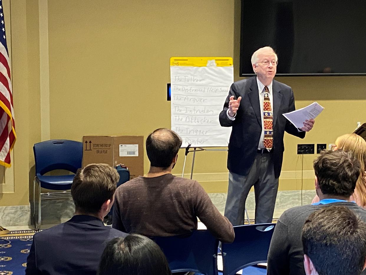 William Doherty, a trained counselor and University of Minnesota professor, speaks to congressional staffers recently about how to handle the difficult and sometimes hostile people who call into lawmakers' offices.