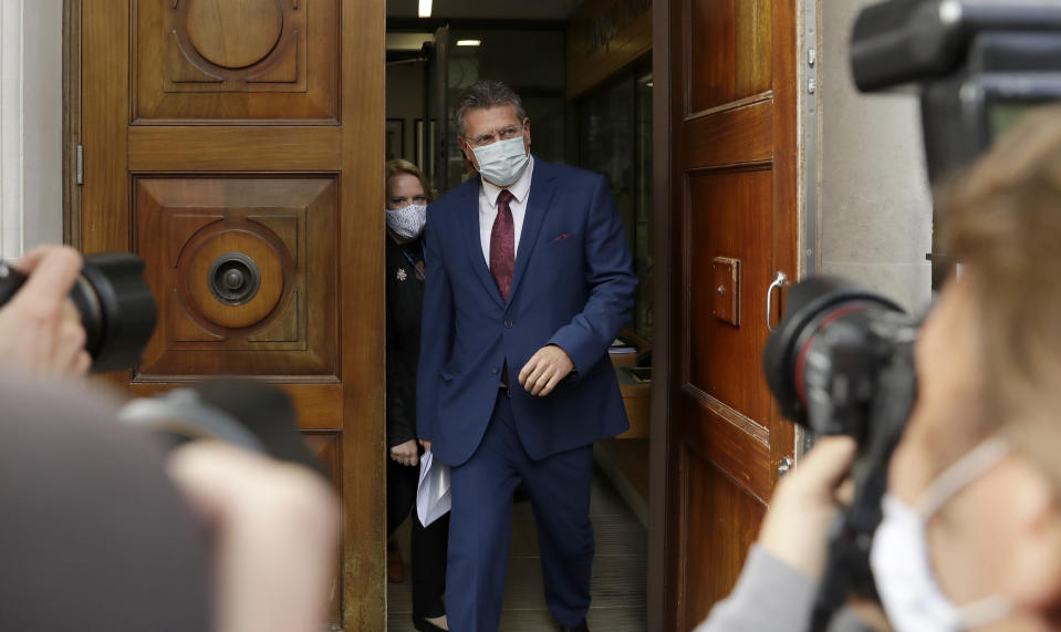 European Commission Vice President Maros Sefcovic is watched by photographers as he leaves the Europa house in London, Thursday, Sept. 10, 2020. UK and EU officials have their eighth round of Brexit negotiations in London. (AP Photo/Matt Dunham)