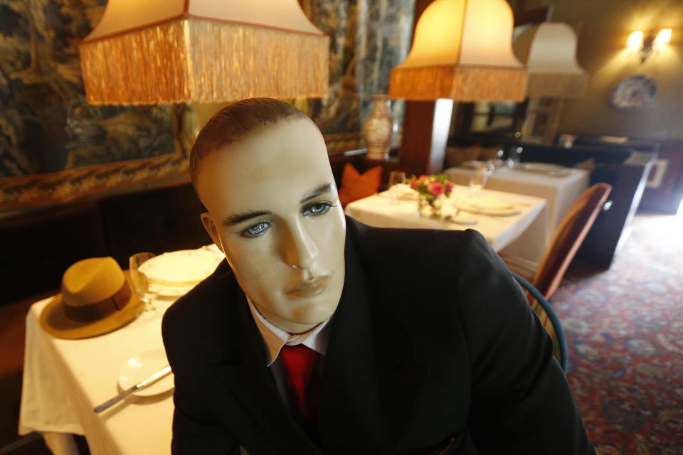 Mannequins provide social distancing at the Inn at Little Washington as they prepare to reopen their restaurant Thursday May 14, 2020, in Washington, Va. The manager say that every other table will have mannequins for social distance guidance when, according to state guidelines, the 5-star restaurant will be allowed reopen on May 29th. (AP Photo/Steve Helber)