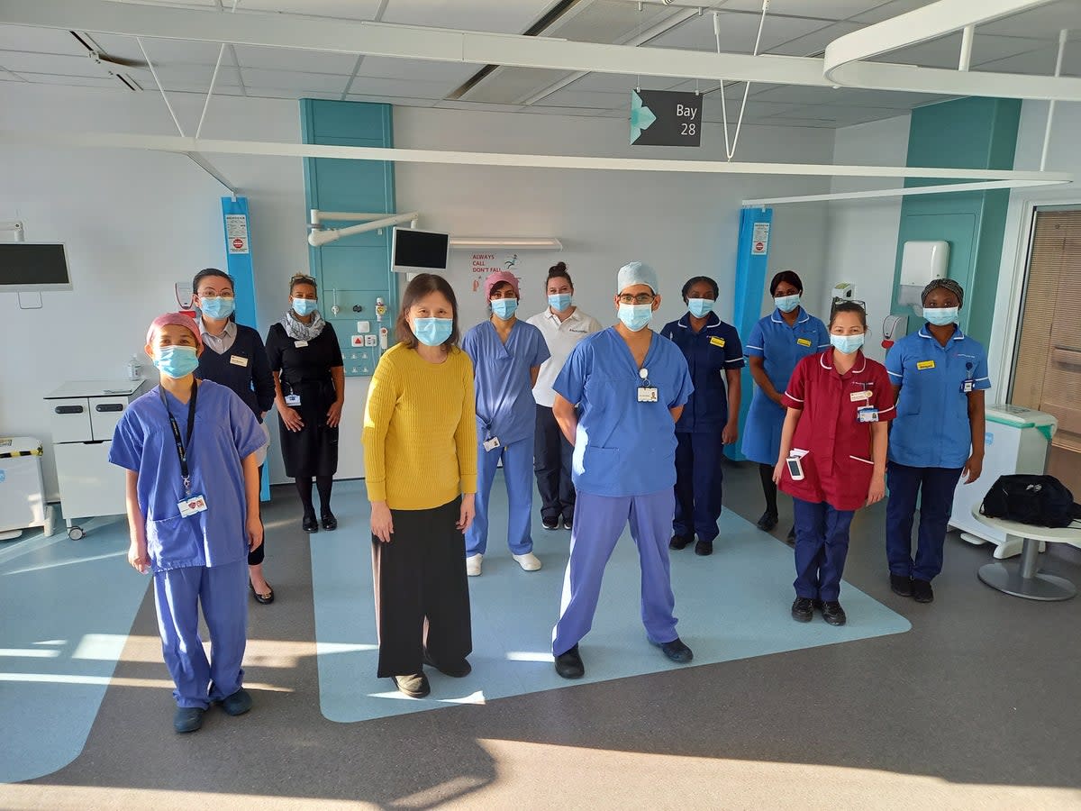 Patient Cheng Ong (second from front left) alongside staff who treated her at Chase Farm Hospital (Royal Free London NHS Trust)