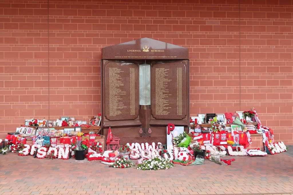 Flowers and tributes left at the Hillsborough Memorial outside Anfield stadium (Peter Byrne/PA) (PA Wire)
