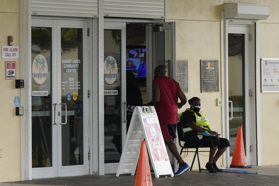 A man walks into a polling place at the Sunset Lakes Community Center, as voting takes place in a special election for Florida's 20th Congressional District seat, Tuesday, Jan. 11, 2022, in Miramar, Fla. Democratic Sheila Cherfilus-McCormick, a health care company CEO, faces Republican Jason Mariner in the special election to fill the US congressional seat left vacant after Democratic U.S. Rep. Alcee Hastings died last April of pancreatic cancer. (AP Photo/Rebecca Blackwell)