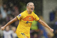 Barcelona's Fridolina Rolfo celebrates after scoring her side's second goal during the Women's Champions League, semi final second leg, soccer match between FC Chelsea and FC Barcelona in London, England, Saturday, April 27, 2024. (Zac Goodwin/PA via AP)